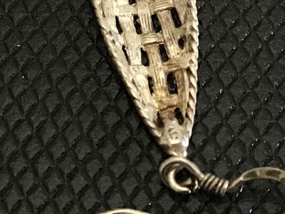 Sale Photo Thumbnail #223: Pair of vintage silver teardrop-shaped dangle earrings featuring a textured, woven basketweave design with french hook wire closures. Stamped 925 on the reverse loop connector. Measure approximately 1.5 inches in length. In good pre-owned condition with l