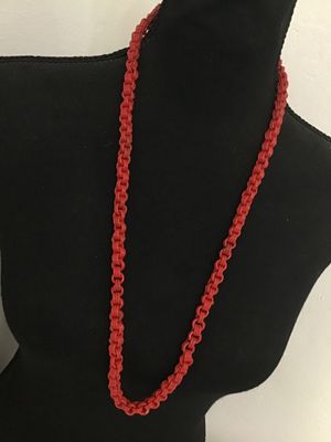Sale Photo Thumbnail #120: Long vintage bright red molded plastic chain link necklace. Features textured, multi-strand style interlocking links. Continuous opera length style with no clasp. Good vintage condition with light wear consistent with age.