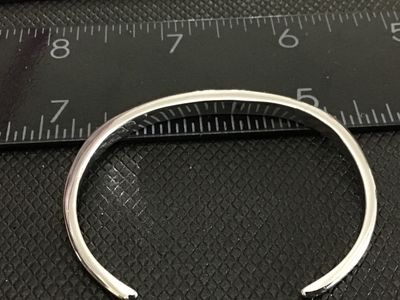 Sale Photo Thumbnail #170: Slim silver cuff bracelet featuring crushed turquoise channel inlay along the top edge. Measures approximately 2.5 inches wide with an open gap for easy wear. In good condition with minimal surface wear.