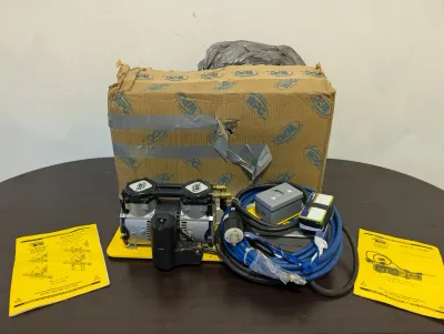 Sale Photo Thumbnail #80: Wood's Powr-Grip vacuum pump system on a yellow base plate, complete with power cords, accessories, instruction manuals, and the original cardboard box.