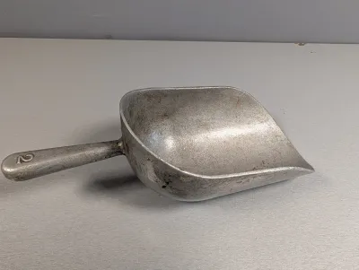 Sale Photo Thumbnail #258: Vintage cast aluminum grain or utility scoop stamped with number 2 on the handle.