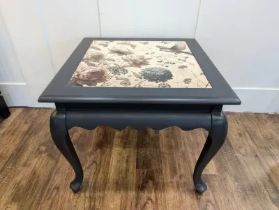 Sale Photo Thumbnail #468: Upcycled black painted side table featuring a floral and bird decoupage inset top and cabriole legs.