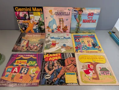 Sale Photo Thumbnail #183: Collection of vintage children's vinyl records and read-along book sets from the 1960s and 1970s, including Walt Disney titles, Gemini Man, and Planet of the Apes.