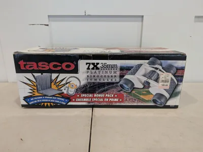 Sale Photo Thumbnail #487: Vintage Tasco 7x35mm Platinum binocular set in original retail box, including bonus stadium seat cushion and AM/FM radio.