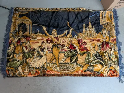 Sale Photo Thumbnail #428: Vintage velvet tapestry wall hanging featuring a detailed Middle Eastern or Central Asian dance scene with fringed edges.