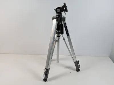 Sale Photo Thumbnail #92: SV Kenlock 3000 AF aluminum camera tripod featuring an adjustable three-way pan head, geared center column, and quick-release leg locks.