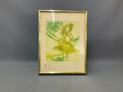 Sale Photo Thumbnail #140: Framed limited edition etching of birds perched on branches, set in a thin metallic gold-tone frame with a certificate seal on the matting.
