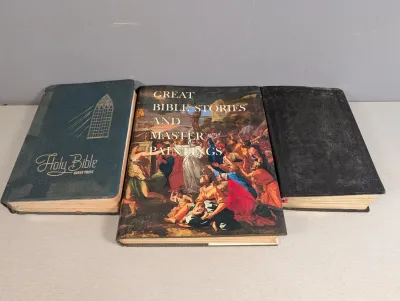 Sale Photo Thumbnail #269: Collection of three vintage religious books, including a giant print Holy Bible and 'Great Bible Stories and Master Paintings', showing moderate shelf wear.