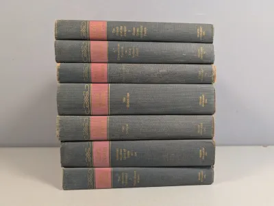 Sale Photo Thumbnail #312: Seven-volume vintage Mark Twain hardcover book collection published by Nelson Doubleday, Inc., featuring blue cloth covers with gilt spine lettering.