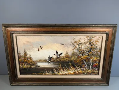 Sale Photo Thumbnail #448: Framed vintage impasto oil painting depicting ducks taking flight over a lake surrounded by autumn trees.
