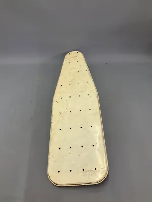 Sale Photo Thumbnail #334: Vintage off-white metal ironing board top featuring a perforated steam vent pattern, showing light surface wear and patina.