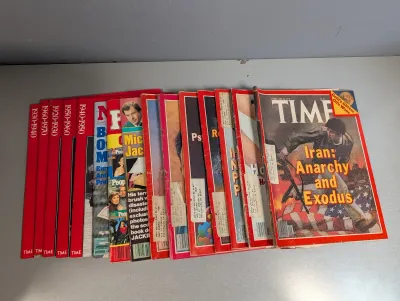 Sale Photo Thumbnail #290: Collection of vintage magazines, including a February 1979 Time magazine featuring 'Iran: Anarchy and Exodus' on the cover, along with various People magazines and Time book series.