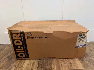 Sale Photo Thumbnail #473: Cardboard box containing an Oil-Dri L90781 synthetic absorbent roll.
