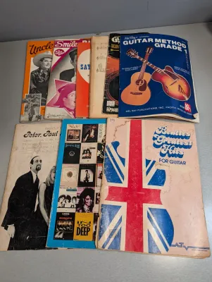 Sale Photo Thumbnail #293: Collection of vintage sheet music books and guitar instruction manuals, including publications for The Beatles, Mel Bay, and Peter, Paul and Mary.