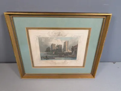 Sale Photo Thumbnail #452: Framed antique hand-colored engraving depicting a coastal castle scene with boats, presented in a green mat and giltwood frame.