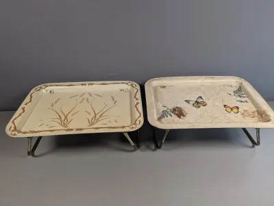 Sale Photo Thumbnail #254: Pair of vintage mid-century metal folding TV lap trays, featuring wheat sheath and butterfly floral motifs with minor age-related wear.