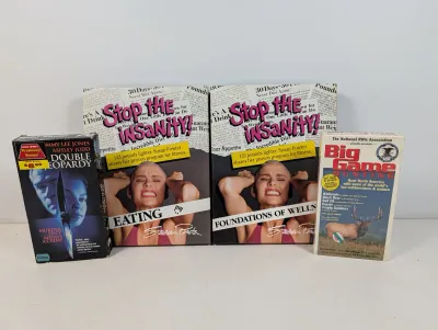 Sale Photo Thumbnail #105: Collection of 1990s VHS tapes, including two Susan Powter 'Stop the Insanity!' fitness videos, 'Double Jeopardy', and an NRA 'Big Game Hunting' tape.