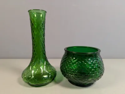 Sale Photo Thumbnail #206: Pair of vintage emerald green glassware pieces, including a diamond-patterned tall vase and a fish scale textured bowl.