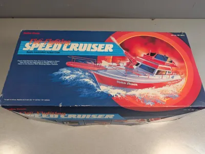 Sale Photo Thumbnail #36: Vintage Radio Shack Fire-Fighting Speed Cruiser radio-controlled action craft in its original packaging.