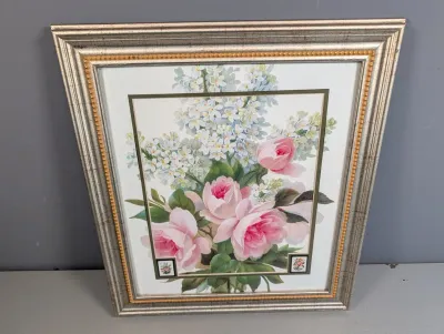 Sale Photo Thumbnail #461: Framed botanical art print depicting pink roses and white lilacs, housed in a metallic silver and beaded gold frame.
