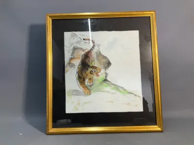 Sale Photo Thumbnail #83: Framed Asian-style watercolor and ink painting depicting a prowling tiger, matted with a dark background and presented in a thin gold frame.