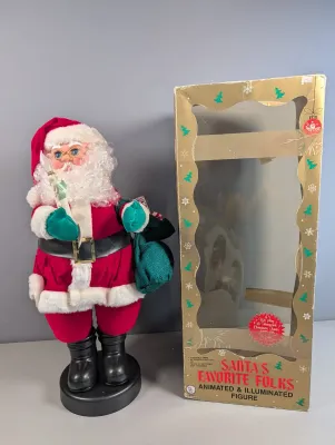 Sale Photo Thumbnail #38: Vintage Santa's Favorite Folks animated and illuminated Santa Claus figure holding a candle, complete with its original retail box.