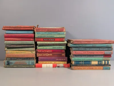 Sale Photo Thumbnail #236: Large collection of vintage mid-20th-century educational textbooks, including arithmetic, reading, science, and geography hardcovers.