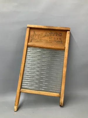 Sale Photo Thumbnail #326: Vintage Atlantic No. 510 glass scrub washboard by National Washboard Co., featuring a wooden frame and ribbed glass panel.