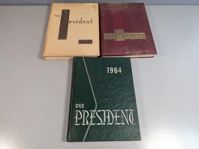 Sale Photo Thumbnail #266: Trio of vintage hardbound school yearbooks titled 'The President,' including editions from 1964 and 1965, displaying light shelf wear.