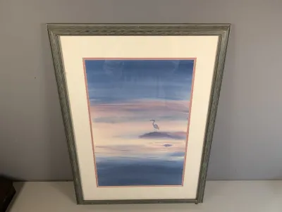 Sale Photo Thumbnail #13: Framed watercolor print depicting a heron on a misty shoreline, housed in a double mat and weathered gray wooden frame.