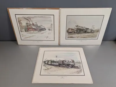 Sale Photo Thumbnail #440: Set of three matted Casey Holtzinger art prints featuring historical Virginia train and railroad scenes, preserved in plastic sleeves.