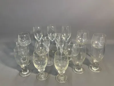 Sale Photo Thumbnail #55: Collection of assorted clear crystal stemware and glassware, featuring wine glasses, cordials, and cognac snifters.