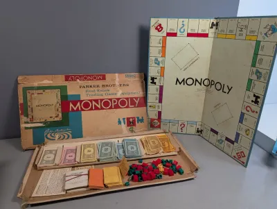 Sale Photo Thumbnail #230: Vintage Parker Brothers Monopoly board game featuring original box, game board, play money, property cards, and wooden houses and hotels.