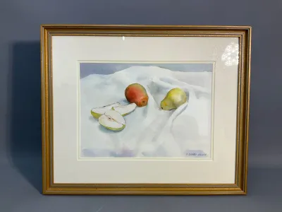 Sale Photo Thumbnail #136: Framed watercolor still life painting depicting whole and sliced pears on a draped white cloth, signed by artist P. Deady Bohon.