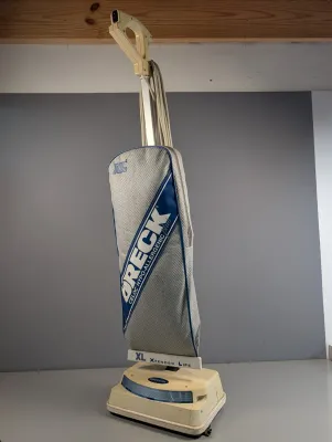 Sale Photo Thumbnail #395: Oreck XL2 Hypo-Allergenic Plus upright vacuum cleaner with grey and blue fabric bag casing, showing moderate cosmetic wear.