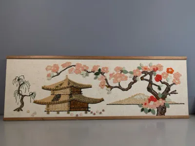 Sale Photo Thumbnail #435: Vintage mid-century crushed glass and gravel Asian-themed wall art, featuring a pagoda, cherry blossom tree, and Mount Fuji in a slim wood frame.