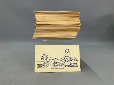 Sale Photo Thumbnail #358: Large stack of vintage novelty postcards featuring comic illustrations, including one titled 'Spring Plowing in Carolina'.