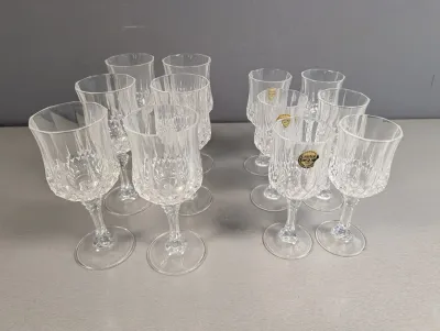 Sale Photo Thumbnail #40: Set of 12 Cristal d'Arques lead crystal stemware glasses in a cut diamond pattern, featuring original maker stickers.
