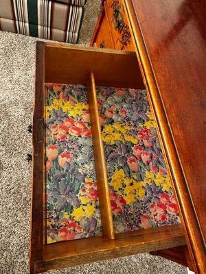 Sale Photo Thumbnail #33: Open wooden dresser drawer lined with colorful floral paper, featuring a central divider and vintage brass hardware.