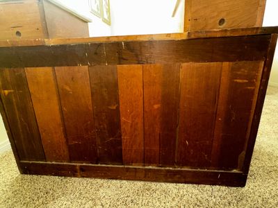 Sale Photo Thumbnail #25: Antique rustic wooden counter featuring paneled construction and a warm, aged patina.
