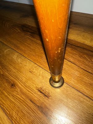 Sale Photo Thumbnail #35: Detail view of a mid-century tapered wooden furniture leg featuring a brass ferrule foot.