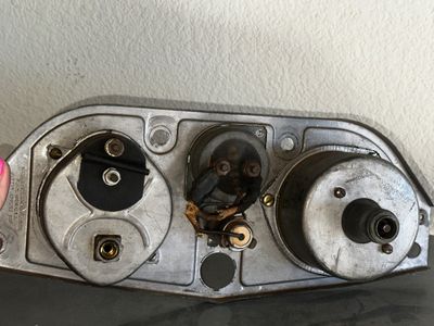 Sale Photo Thumbnail #6: Vintage AC Spark Plug Co. metal gauge cluster housing with original wiring and gauge backings, showing light patina.