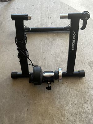 Sale Photo Thumbnail #9: Alpcour magnetic bicycle trainer stand with quick-release skewer mechanism and attached cord.
