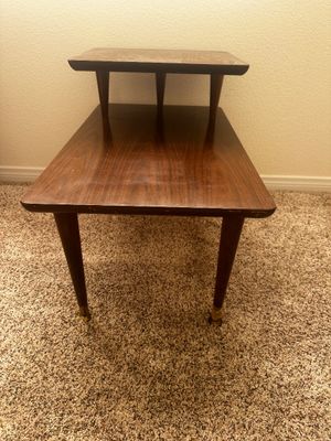 Sale Photo Thumbnail #38: Mid-century modern two-tier wood step end table featuring tapered legs with brass-tone ferrules.