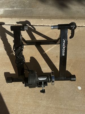 Sale Photo Thumbnail #8: Alpcour magnetic bike trainer stand with adjustable resistance, designed for indoor cycling workouts.