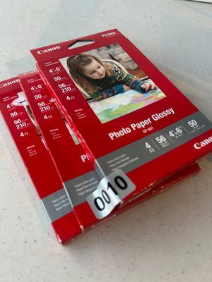 Sale Photo Thumbnail #10: Lot of three packages of Canon PIXMA GP-601 Photo Paper Glossy. Each pack contains 50 sheets of 4" x 6" (10 x 15 cm) inkjet photo paper, 56 lb (210 g/m²). Packages appear sealed/unopened in original packaging.