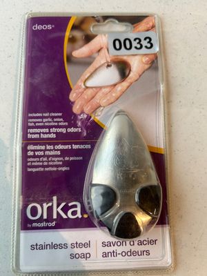 Sale Photo Thumbnail #33: New in original blister packaging, an Orka by Mastrad 'deos' stainless steel soap bar (savon d'acier anti-odeurs). Designed to remove strong odors like garlic, onion, fish, and nicotine from hands, and includes an integrated nail cleaner.