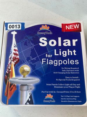 Sale Photo Thumbnail #13: SunnyTech solar-powered flagpole light, new in box. Designed for use with in-ground flagpoles 15 to 25 feet. Features self-charging solar panels with no wiring required for easy installation.