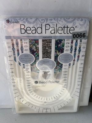 Sale Photo Thumbnail #80: New in original plastic packaging, a Cousin Bead Palette (item AJM26910) jewelry design tray. Features measured channels for necklaces and bracelets, as well as built-in storage bins for beads and findings.