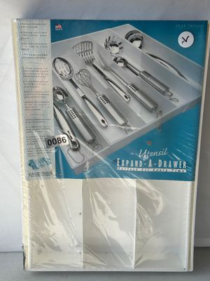 Sale Photo Thumbnail #109: A Neat Things brand Utensil Expand-A-Drawer kitchen organizer, brand new and sealed in its original shrink wrap packaging. Features expanding side panels to fit various drawer sizes and accommodate larger kitchen utensils.
